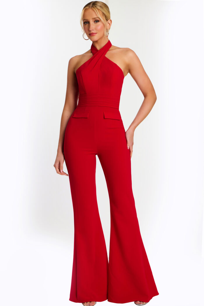 Woman wearing a red halter-neck jumpsuit with wide-leg pants, front view