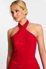 Close-up of red halter-style neckline and pleated waist detailing
