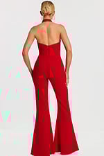 Back view of red jumpsuit showing open back and flared legs