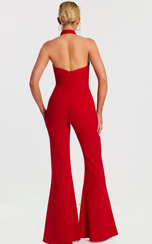 Back view of red jumpsuit showing open back and flared legs