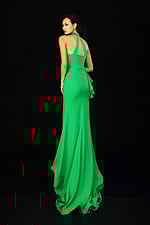 Green halter prom dress with beaded neckline and side ruffle detail