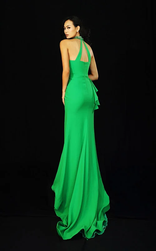 Green halter prom dress with beaded neckline and side ruffle detail
