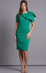 Tailored short sleeve cocktail dress with sculpted shoulder bow viewed from the back