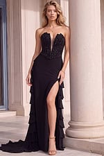 Black evening gown with a sparkling beaded strapless bodice, illusion plunge neckline, dramatic thigh-high slit, and cascading side ruffle details.