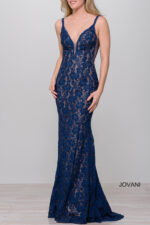 Model wearing Jovani 48994 in navy lace, front view.