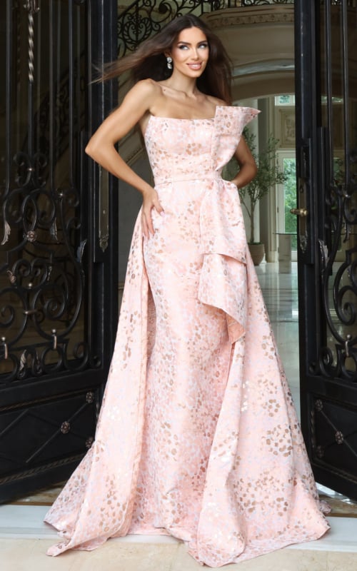 Blush pink metallic gown with asymmetric neckline and draped overskirt, front view