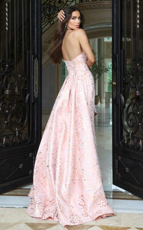 Blush pink metallic strapless ball gown with pleated full skirt, back view