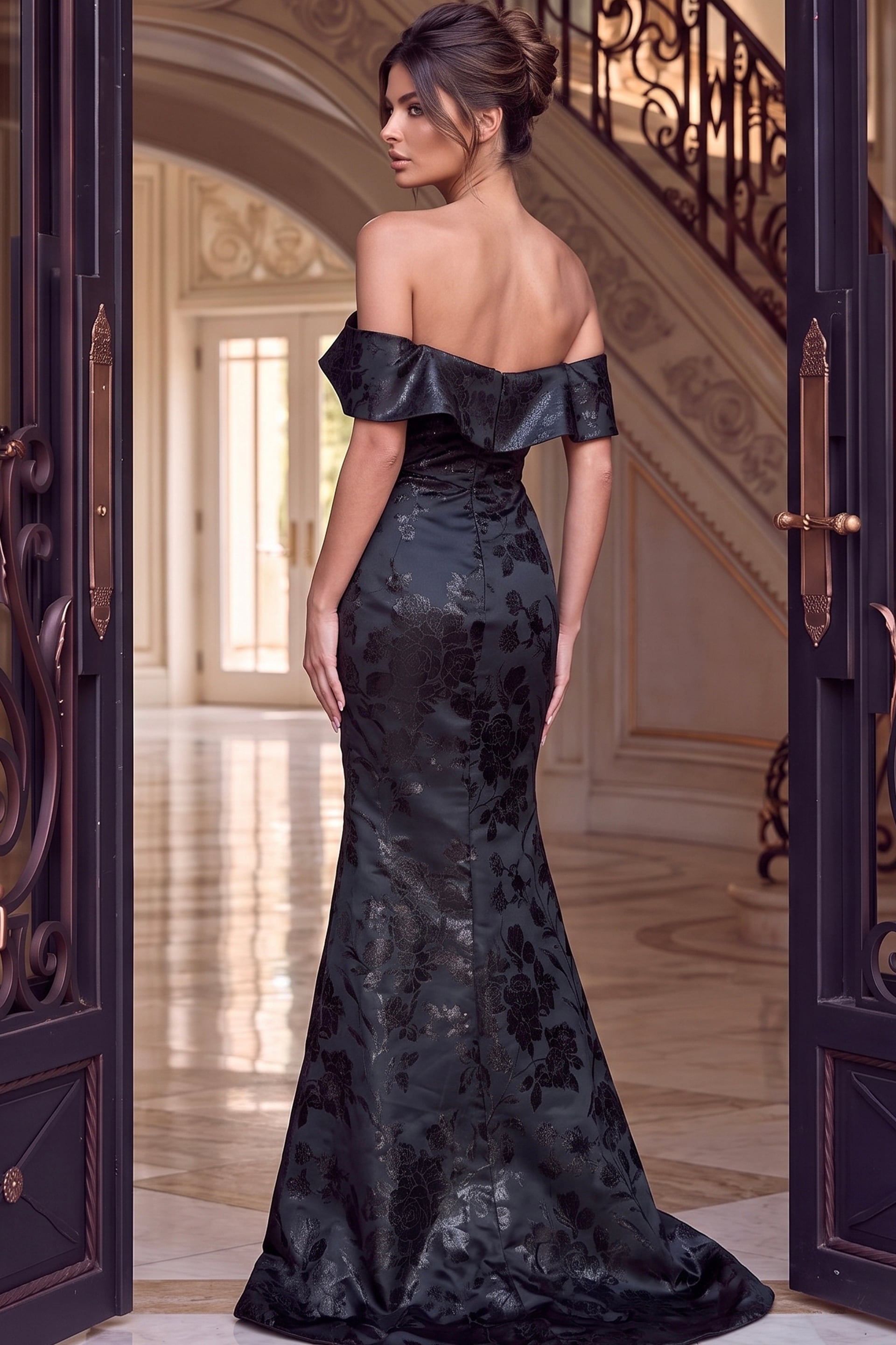 Back view of black jacquard off the shoulder mermaid gown showing the zip back and train