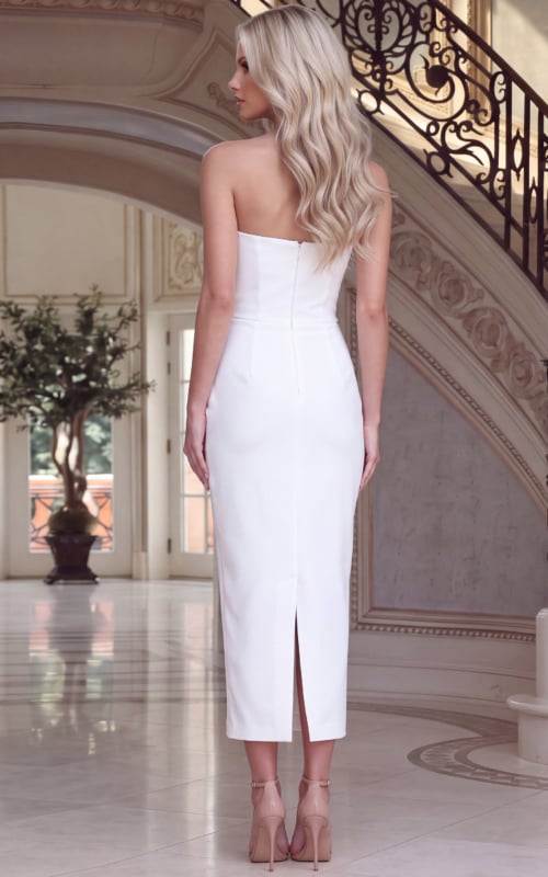 back view of white fitted midi dress with back slit