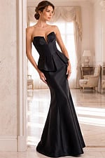 Strapless black satin mermaid gown with sculpted peplum waist and structured neckline.