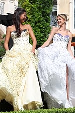 strapless polka dot tiered gown - two girls front, looking at each other holding skirts