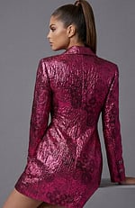 Back view of tailored metallic jacket showing textured fabric and clean seams