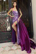 Purple beaded prom dress with high slit and dramatic overskirt