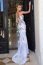 whitemulti strapless sequin dress with high slit - three quarter view, looking over shoulder ornate gate