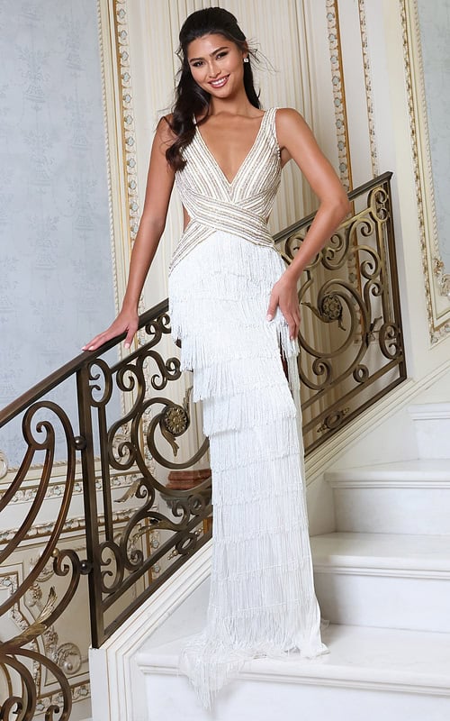 white v neck beaded fringe dress with high slit - front full body, smiling, hand on railing, tiered fringe