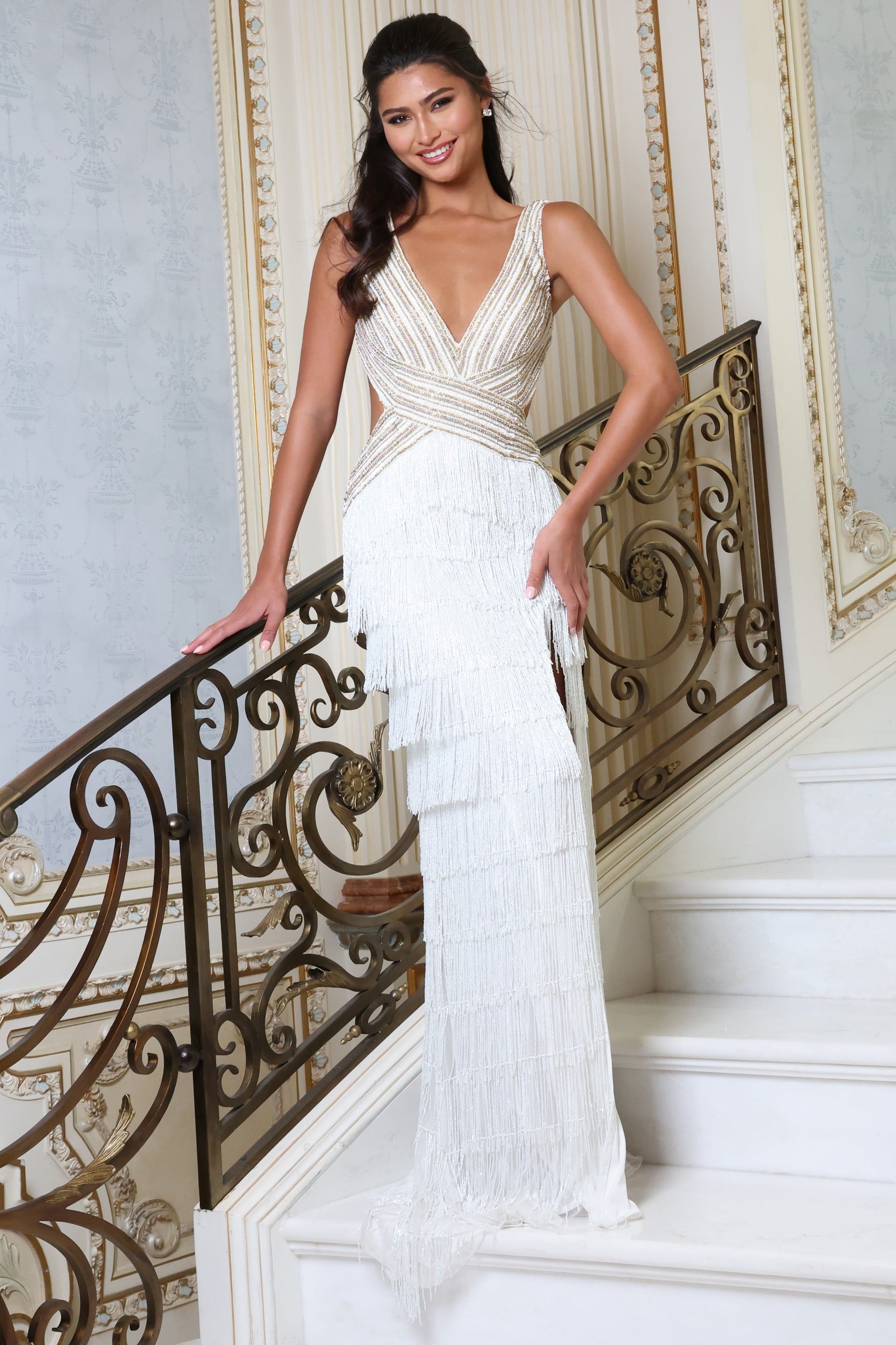 49269_white_2 white v neck beaded fringe dress with high slit - front full body, smiling, hand on railing, tiered fringe