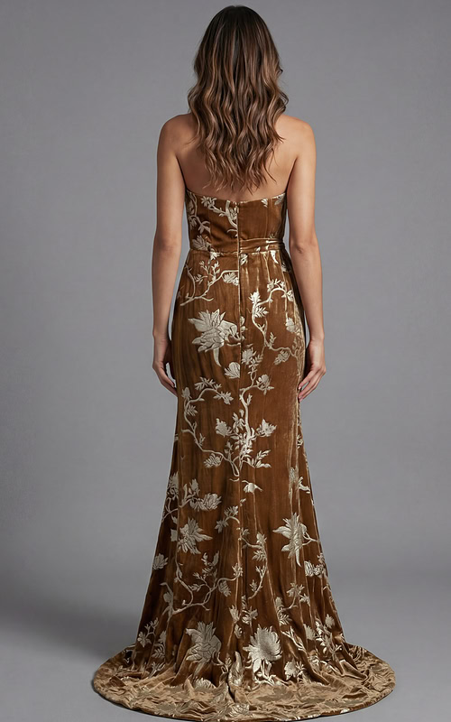 Back view of strapless velvet evening gown with floral brocade detailing and fitted silhouette