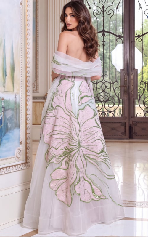 Ivory ball gown from the back, sheer stole across the shoulders above pink petal embroidery