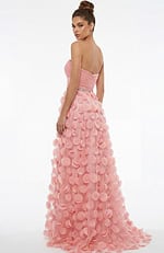 Back view of strapless gown with ruched bodice, beaded waist, and flowing skirt covered in soft circular appliqués