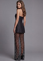 Black fitted mini dress with transparent embellished skirt
