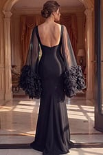 back view of strapless prom dress with open back and voluminous skirt