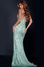 Back view of model in Jovani 49455 green gown with elegant train.
