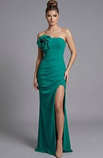 Strapless fitted evening gown with sculpted bodice, thigh high slit, and floral accent