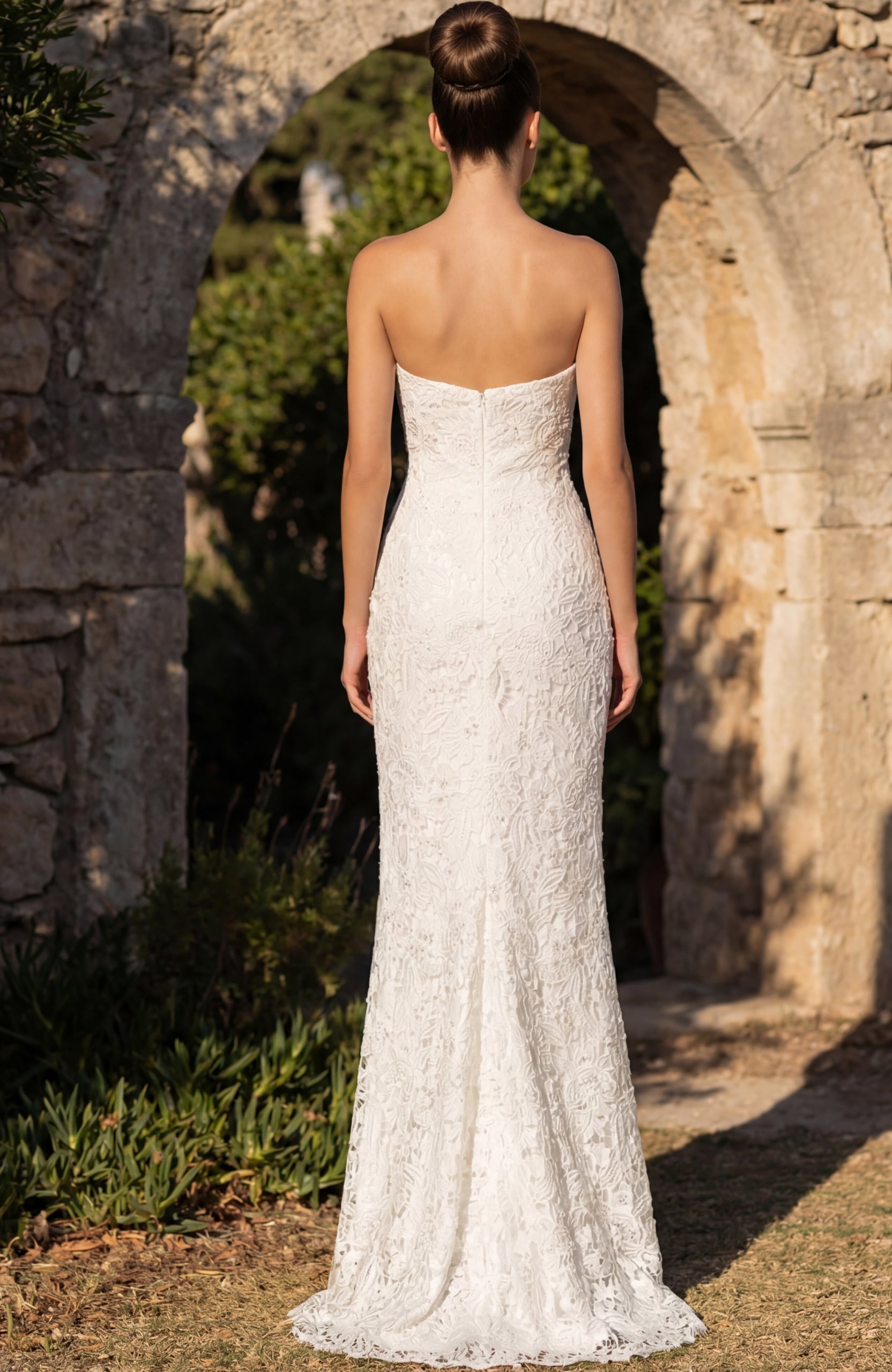 Back view of strapless lace wedding gown with smooth fitted finish