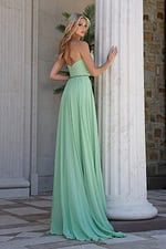 mint strapless coral chiffon a-line gown - three quarter view, leaning column looking over shoulder