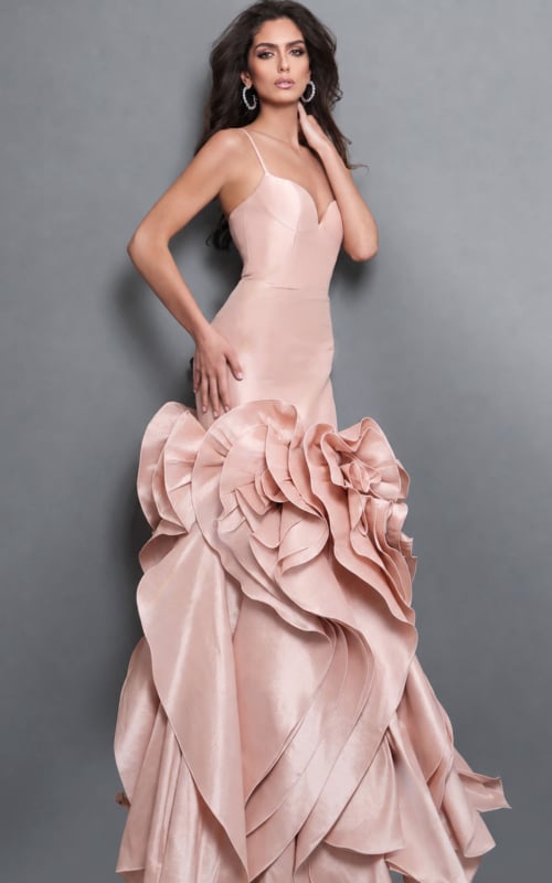 blush satin mermaid gown featuring spaghetti straps, a structured sweetheart neckline, and voluminous sculptural ruffles cascading down the skirt