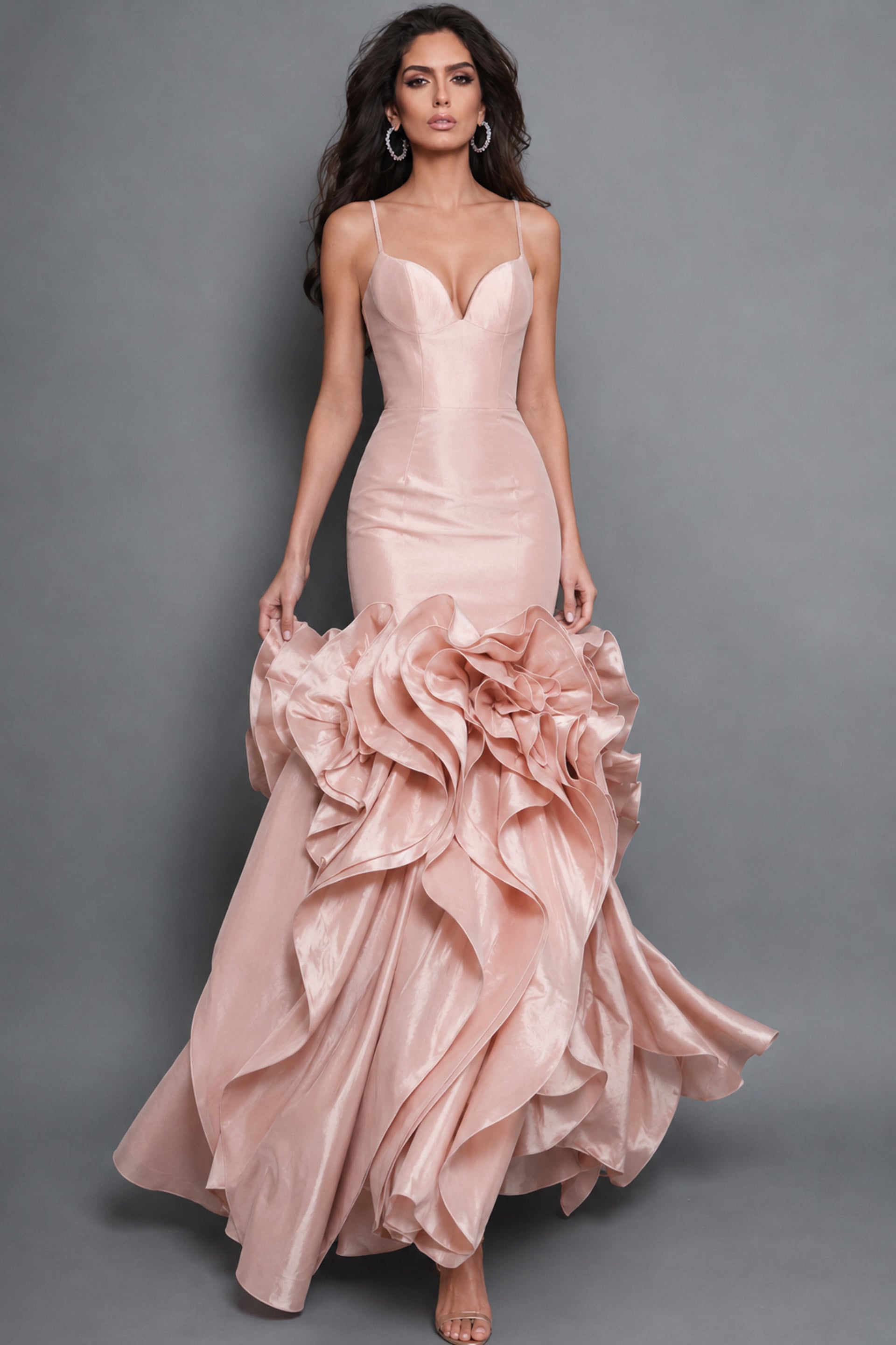 Blush pink satin mermaid gown with delicate spaghetti straps, sculpted floral ruffles, and a fitted sweetheart bodice
