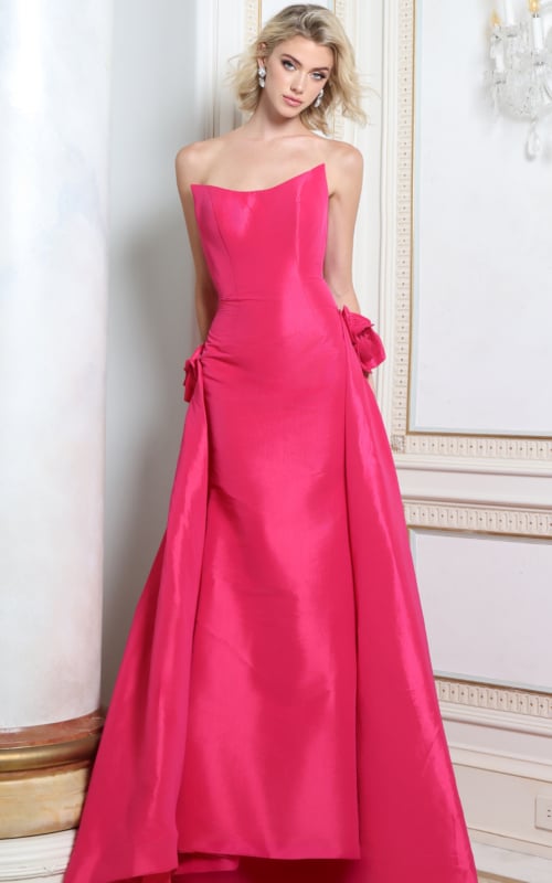Fuchsia satin strapless gown with fabric rosettes at the waist and draped overskirt, front view