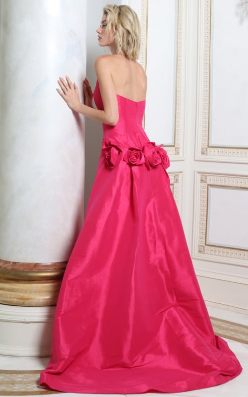Back view of fuchsia satin gown showing rosette cluster and full overskirt train