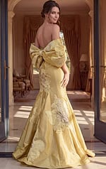 back view of yellow floral applique strapless mermaid gown