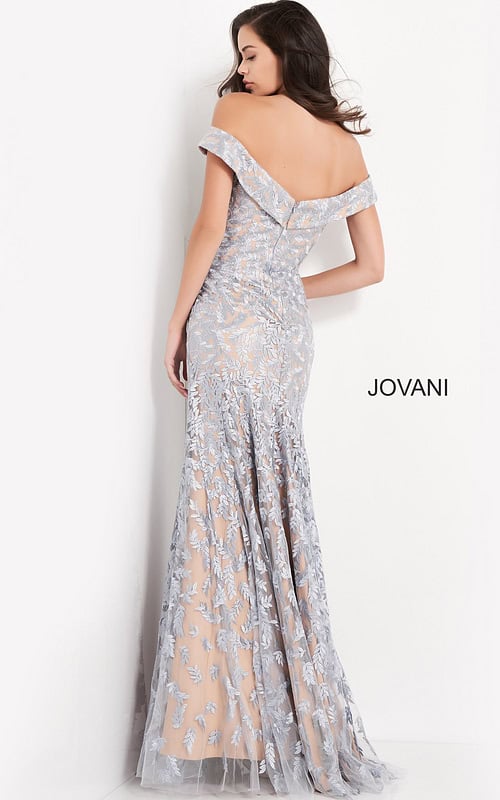 back view of model wearing Jovani 49634 in light blue with intricate lace detailing
