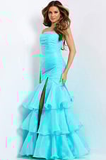 Floor-length strapless gown with fitted silhouette and cascading ruffled hem.