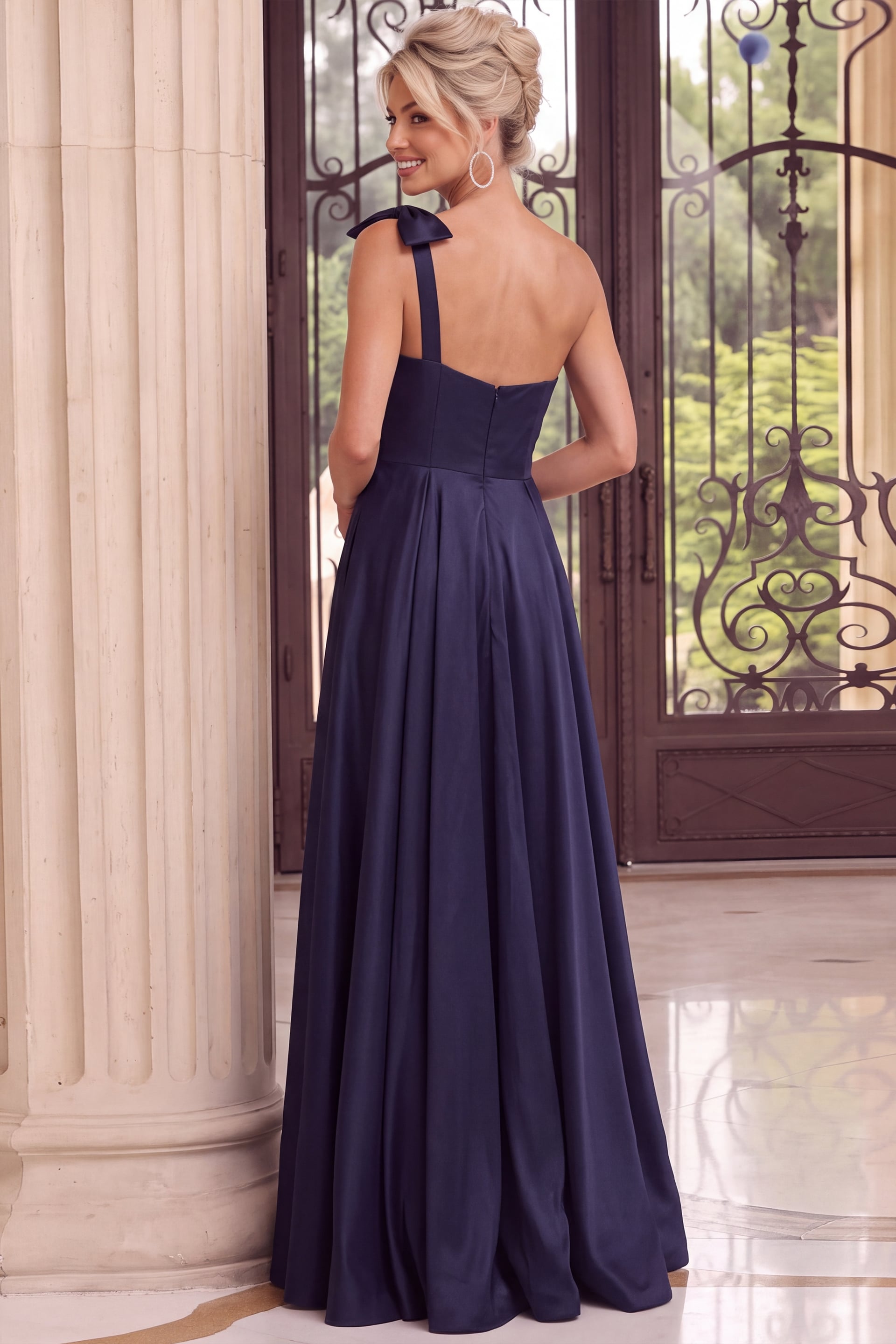 Navy blue one-shoulder satin gown with statement bow and full A-line skirt