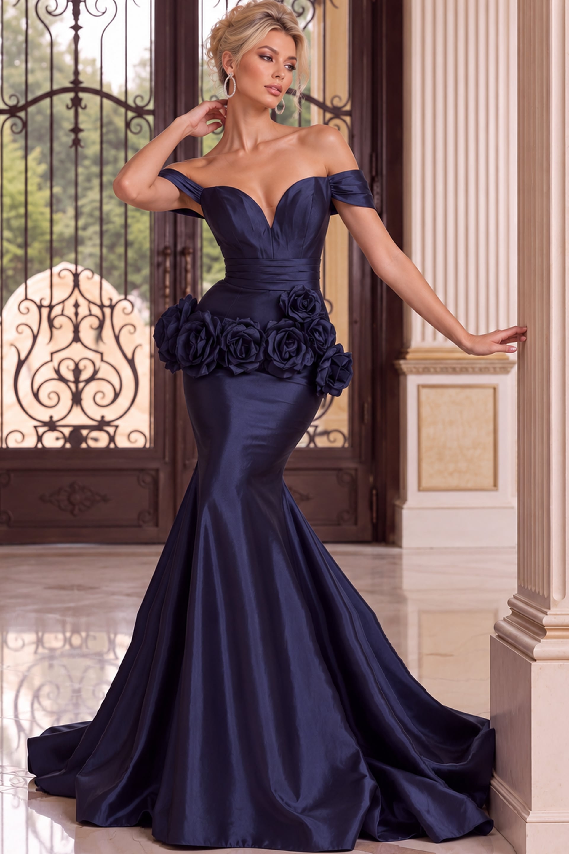Navy off-the-shoulder mermaid gown with plunging neckline, ruched waist, and 3D floral appliqués at the hips