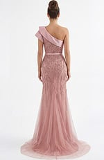 Back view of one shoulder beaded evening gown with sheer tulle train