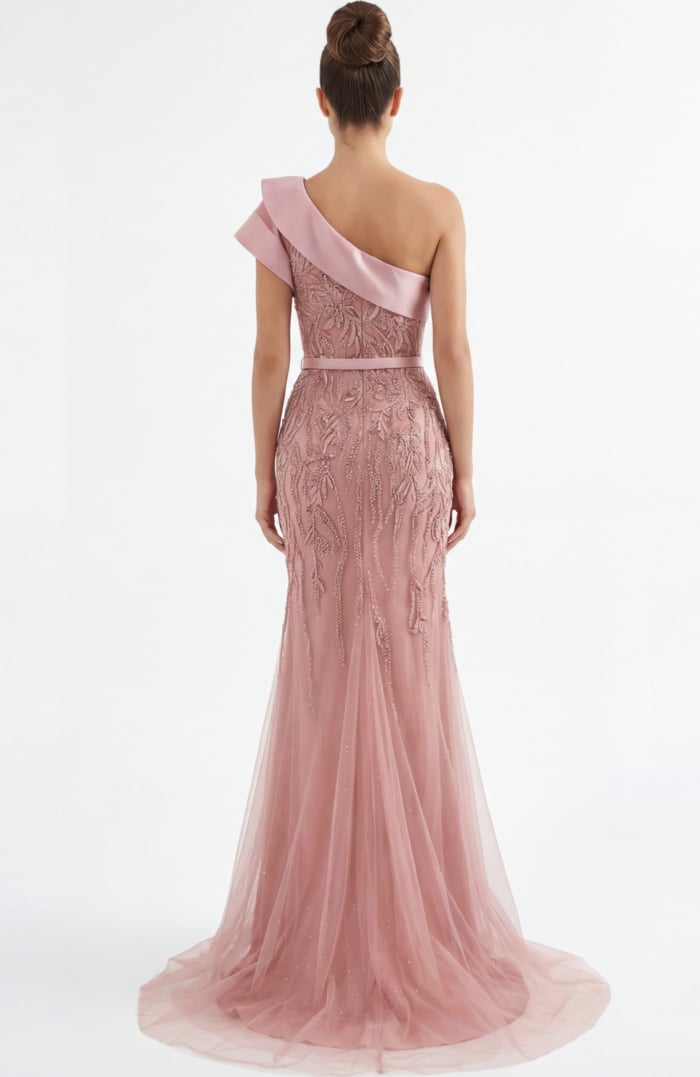 Back view of one shoulder beaded evening gown with sheer tulle train