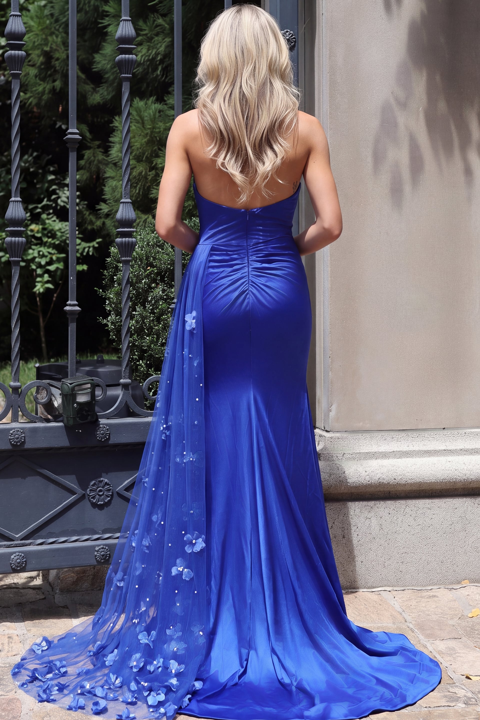 back of royal blue strapless satin gown with ruched seam and floral tulle train 49757
