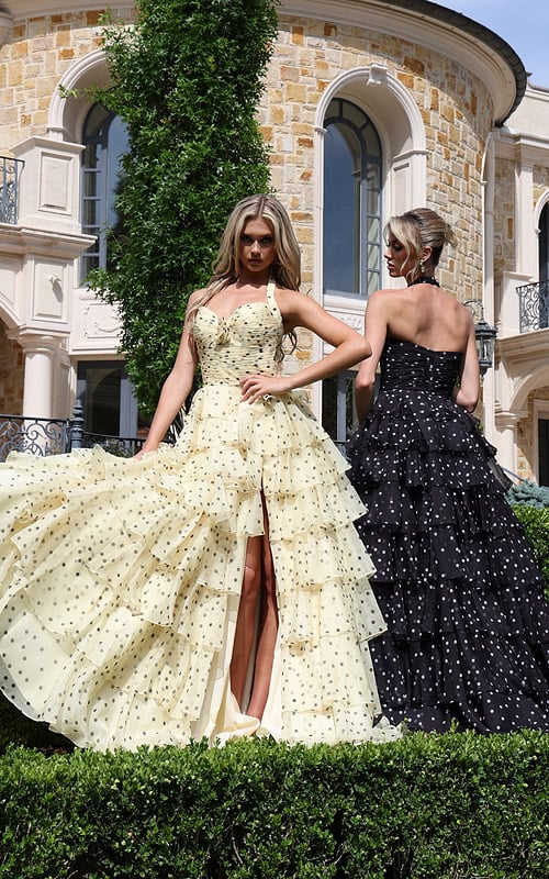 halter polka dot tiered dress with bow bodice - two girls front, blonde slit fanned, black angled