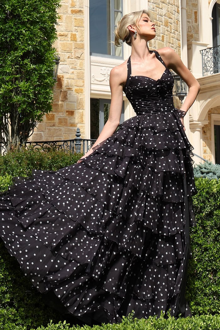blackwhite halter polka dot tiered dress with bow bodice - front full body, blonde updo, fanned skirt, looking upward