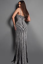 sparkling silver beaded gown with slim straps, a fitted silhouette, and intricate crystal patterns