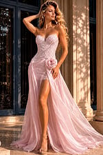Designer evening dress featuring pearl bead embellishments, floral waist detail, and dramatic chiffon train