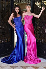 strapless red satin gown - two girls front, blonde curly hair, holding gate