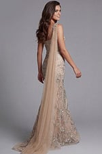 Couture evening gown with dramatic ruffle shoulder and beadwork