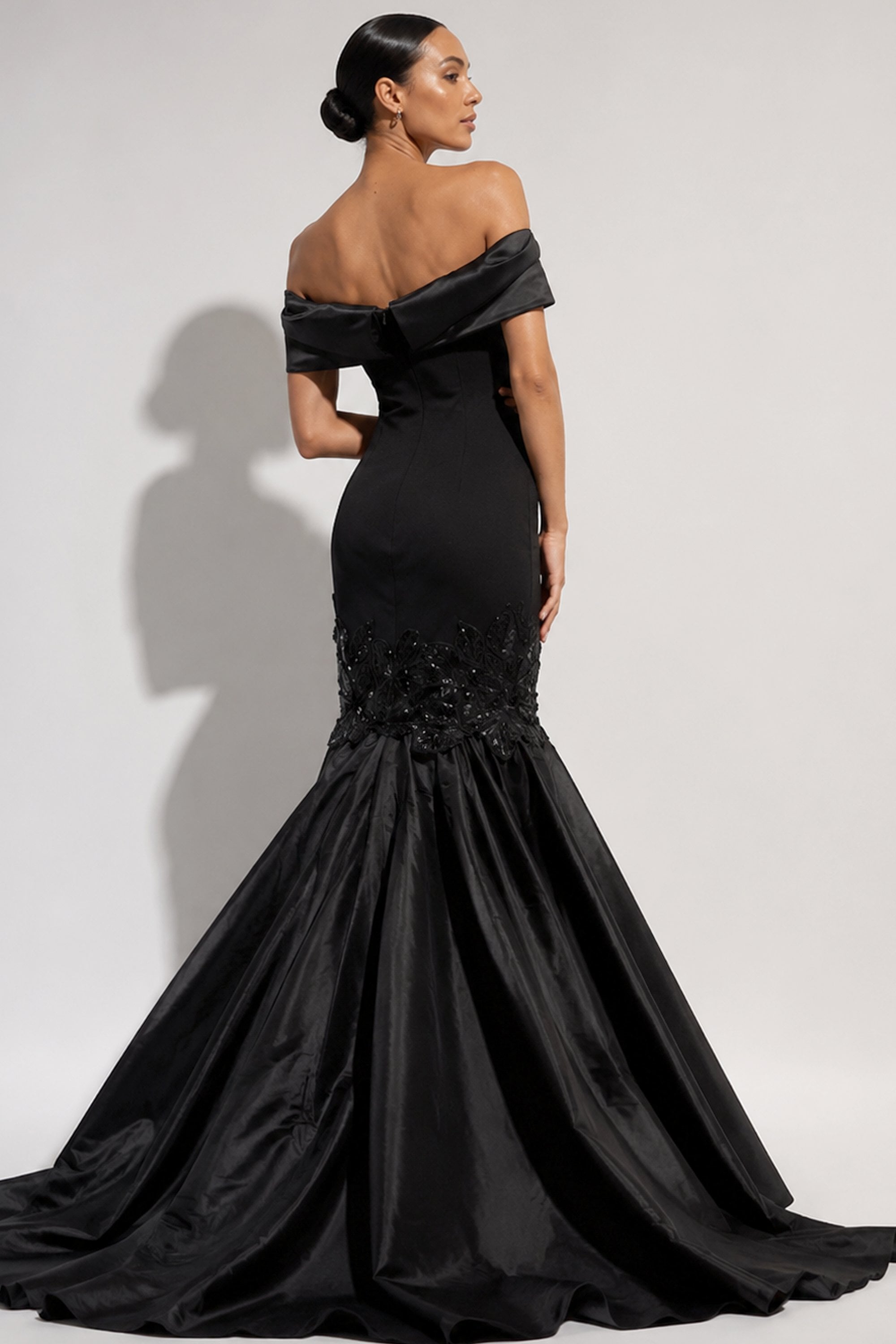 back view of black off shoulder mermaid evening gown