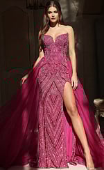 Strapless beaded gown with fitted bodice, high slit, and flowing tulle overskirt for a dramatic layered look