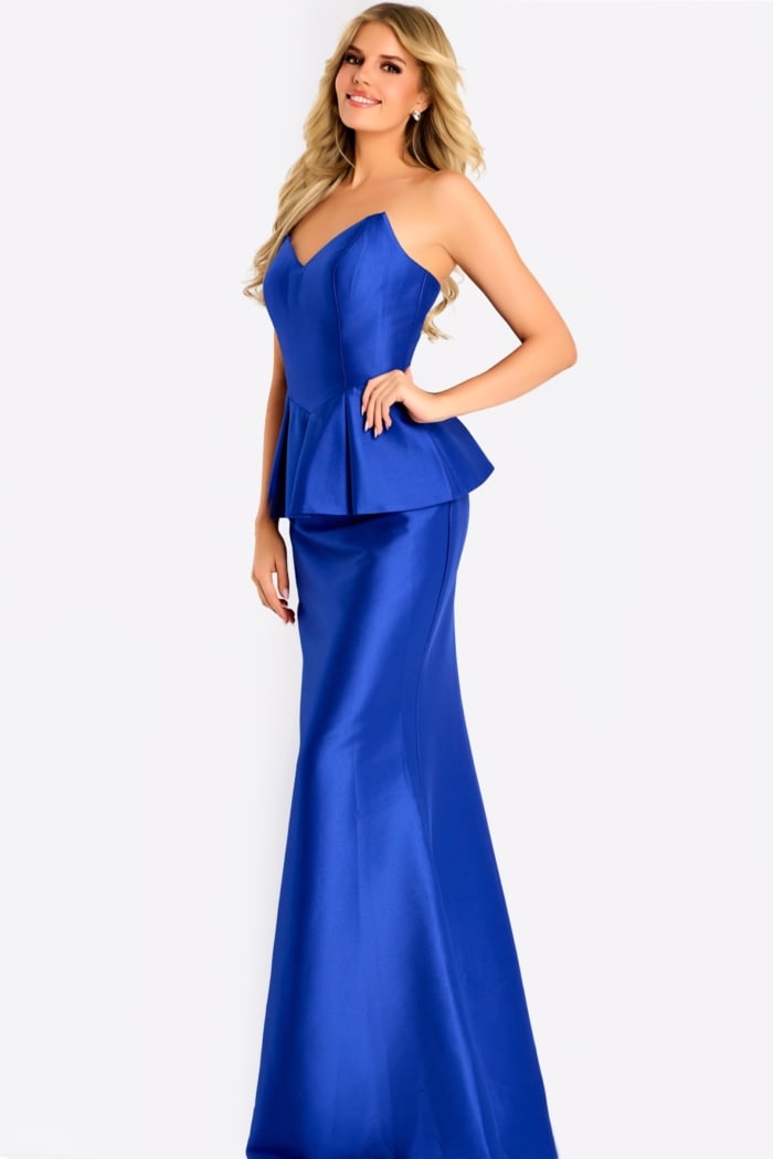 Cold shoulder gown with pleated draped sleeves and an embellished neckline, featuring a sleek fitted silhouette for an elegant evening style.